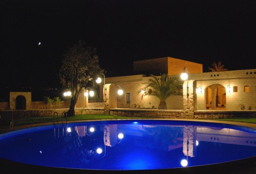 The swimming pool and the house at night