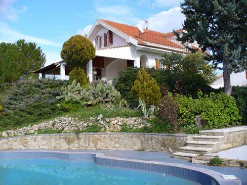 The swimming pool and the house